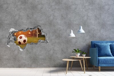 Fototapeta dziura na ścianę 3d Piłka na murawie