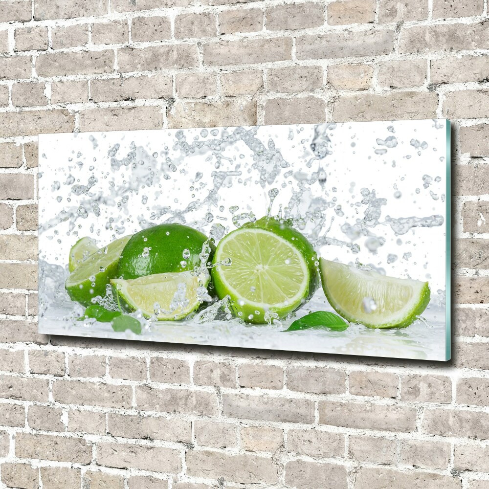 Foto obraz szkło akryl Limonki i woda
